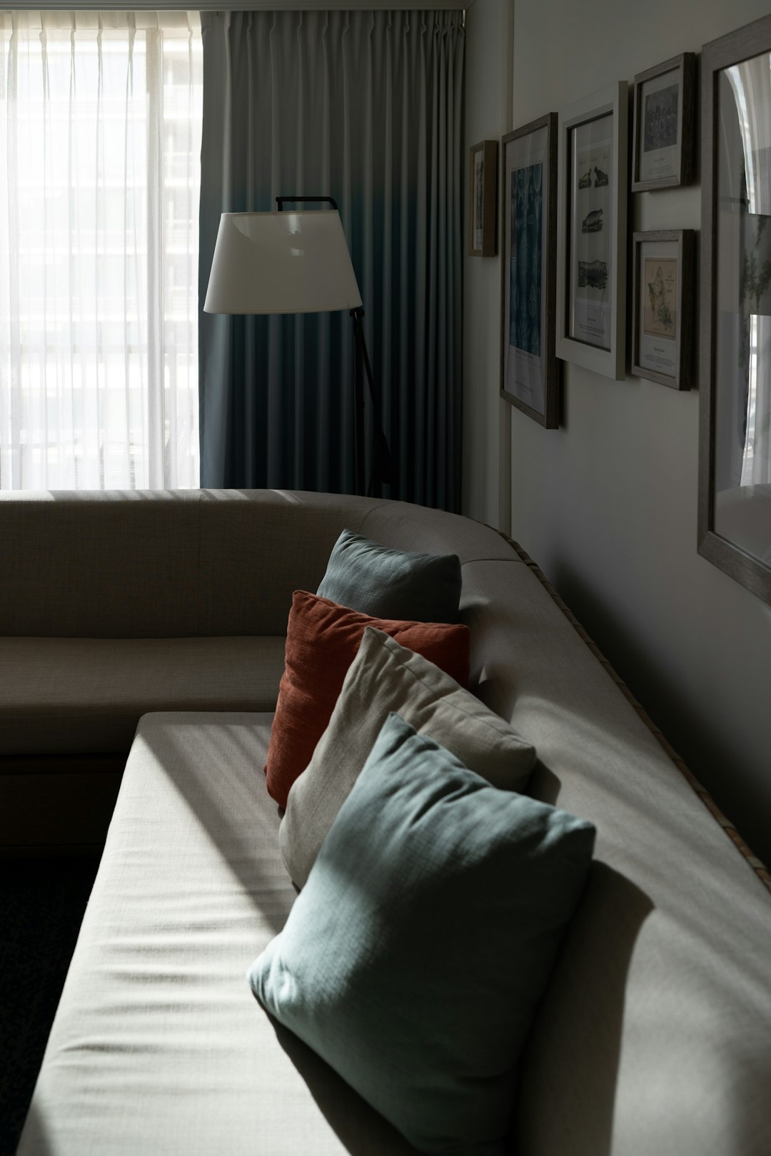 a-living-room-filled-with-furniture-and-a-large-window-frwdijidzkg